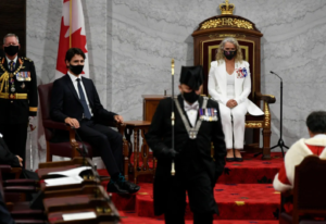 Gov. Gen. Julie Payette, middle, looks on with Chief of Defence Staff Jonathan Vance, left, and Prime Minister Justin Trudeau as the Usher of the Black Rod Greg Peters leaves to summon the House of Commons to come listen to the throne speech in the Senate chamber in Ottawa on Wednesday, Sept. 23, 2020