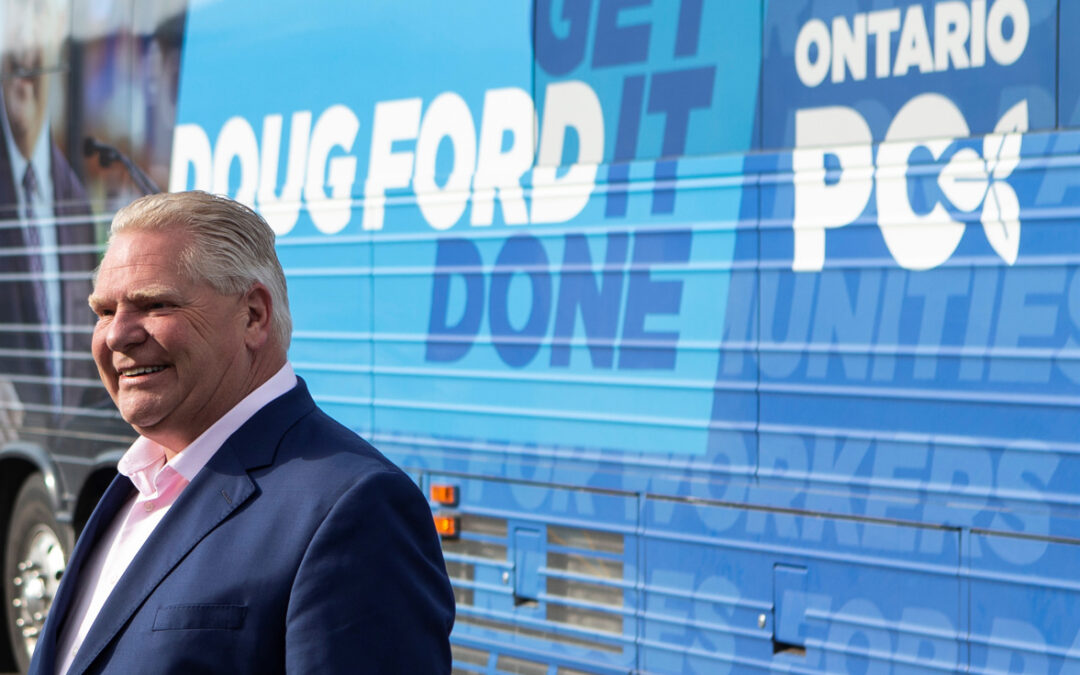 Doug Ford in front of campaign bus (lower res)