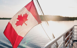 A Canadian flag flies off of a dock