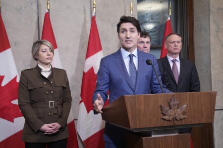 Prime Minister Justin Trudeau holds a news conference on imposed U.S. tariffs as Foreign Affairs Minister Melanie Joly, Finance Minister Dominic LeBlanc and Public Safety Minister David McGuinty look on in Ottawa on Tuesday, March 4, 2025. THE CANADIAN PRESS/Adrian Wyld