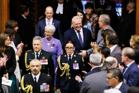 Ontario Lt.-Gov. Edith Dumont, centre left, arrives alongside Ontario Premier Doug Ford ahead of speech from the throne at Queen's Park in Toronto on Tuesday, April 15, 2025. THE CANADIAN PRESS/Cole Burston