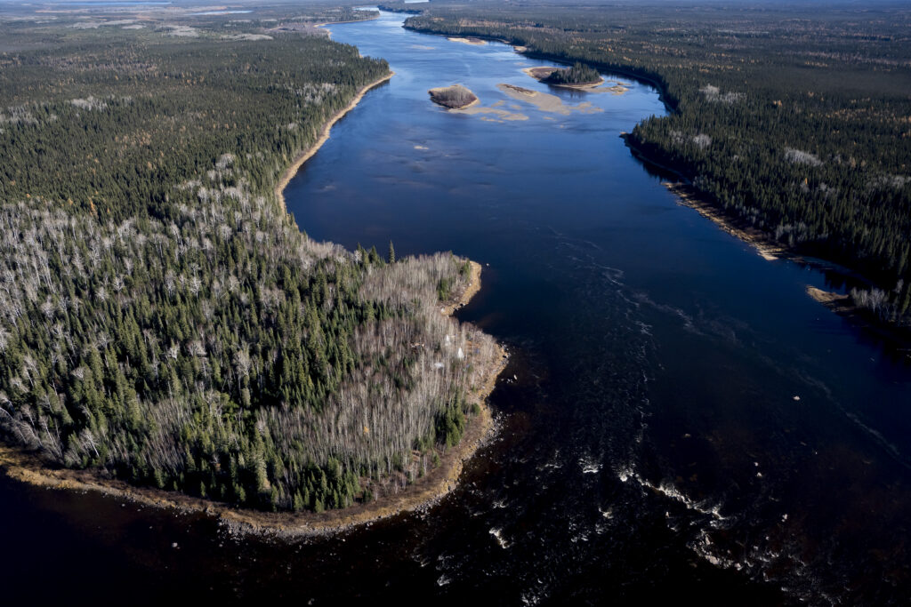 An encampment is seen on the bank of the Attawapiskat river east of Neskantaga, Ont., on Saturday, Oct. 25, 2025. THE CANADIAN PRESS/Christopher Katsarov